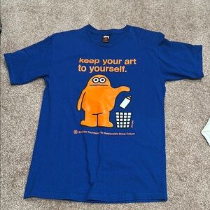 Stussy Blue Graphic T-Shirt with Orange Character